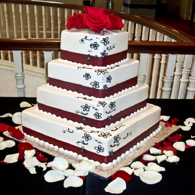 Cake with Red Roses at the Top #wedding