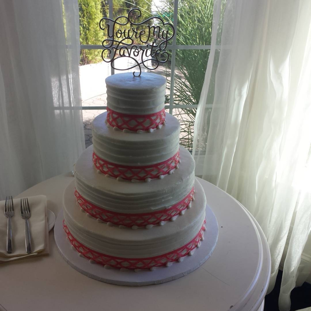 Beautiful coral ribbon on a simple texture cake #specialty #wedding #buttercreamweddings #ctwedding